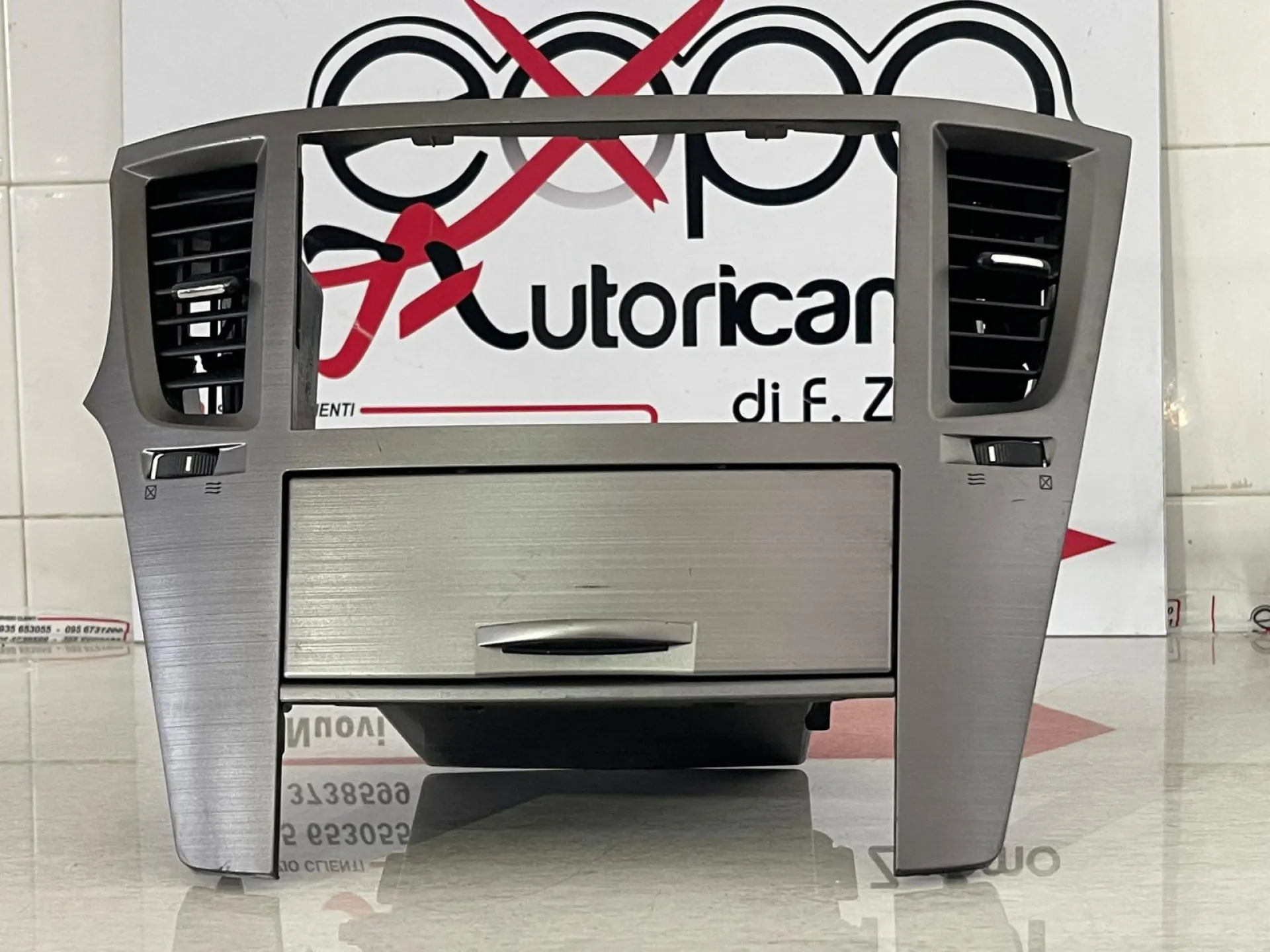 RIVESTIMENTO CONSOLLE CENTRALE con codice 66120AJ030 da SUBARU Outback Serie (03>09)